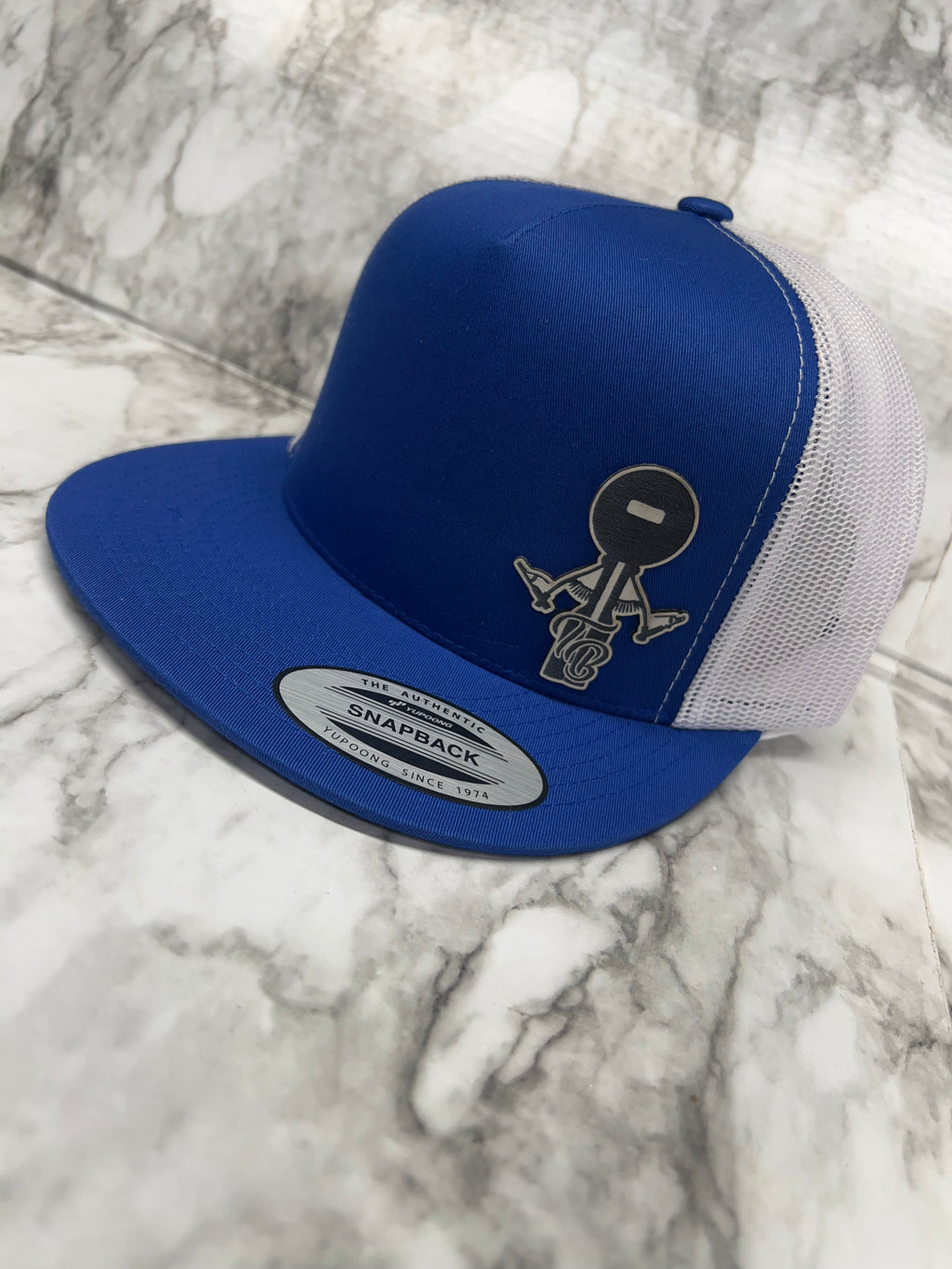 White logo blue hat